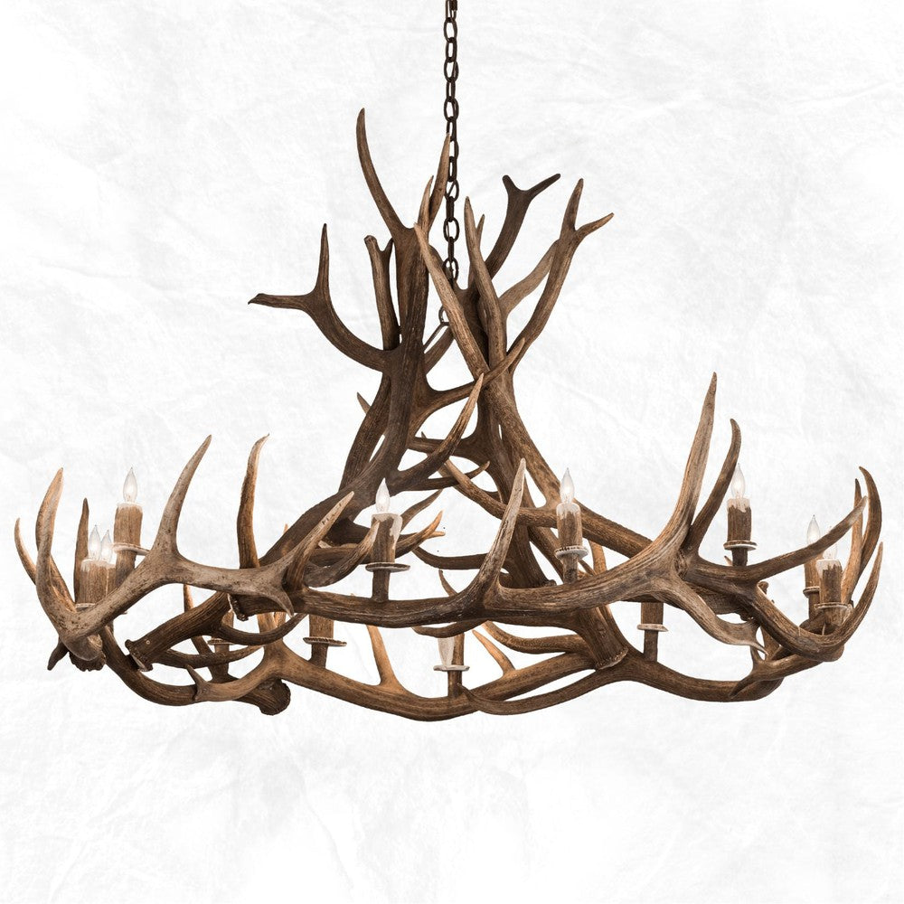 The 12 Light Elk Wagon Wheel Antler Chandelier is a one-of-a-kind piece that combines rustic charm with expert craftsmanship. Handmade by experts in East Texas, this striking lighting fixture is made from 100% authentic shed antlers. UL & ULc listed, it's also wired for safety and comes with a 3' of chain, canopy and mounting hardware. Perfect for creating a dramatic rustic atmosphere in any space. Made to order. Ships in approximately 12-14 weeks.