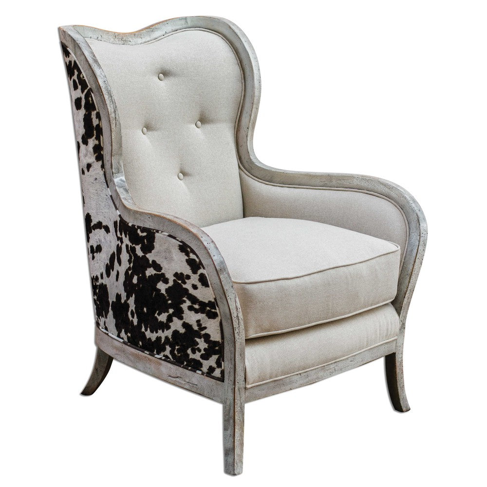 The Chalina Chair is a contemporary piece of art, blending modern design with classic features. Constructed with solid mahogany exposed wood in an aged bone-white finish and surrounding plush dark chocolate and milky white velvet upholstery, the chair boasts a comfortable 19" seat height and a soft linen box cushion. Perfect for adding a touch of style to any room.