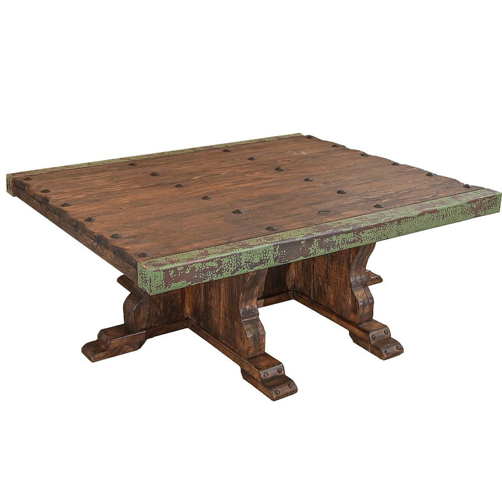 This stylish coffee table is made of reclaimed wood and features carefully wrapped copper edges, adding an elegant touch to any living space. The mix of textures creates a unique statement piece that can easily become the centerpiece of any room.