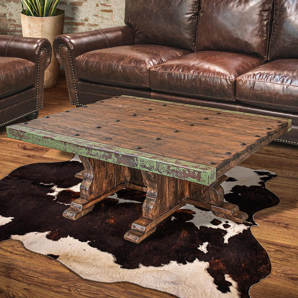 This stylish coffee table is made of reclaimed wood and features carefully wrapped copper edges, adding an elegant touch to any living space. The mix of textures creates a unique statement piece that can easily become the centerpiece of any room.