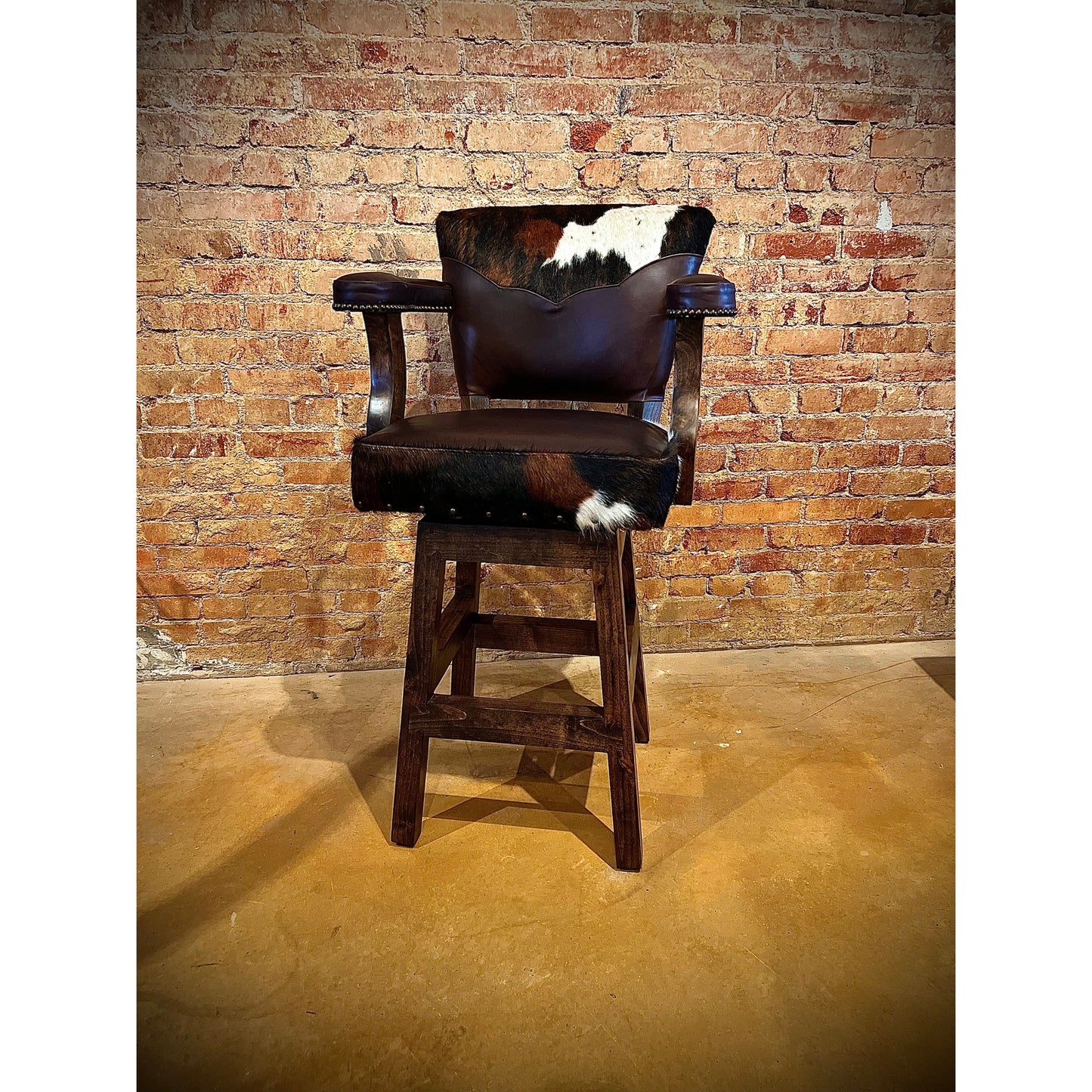 Experience ultimate comfort with our Cowhide Chisum Barstool. Crafted with genuine cowhide, these barstools bring a touch of western style to any room. Relax and enjoy a comfortable seat while adding a unique and stylish touch to your home decor.