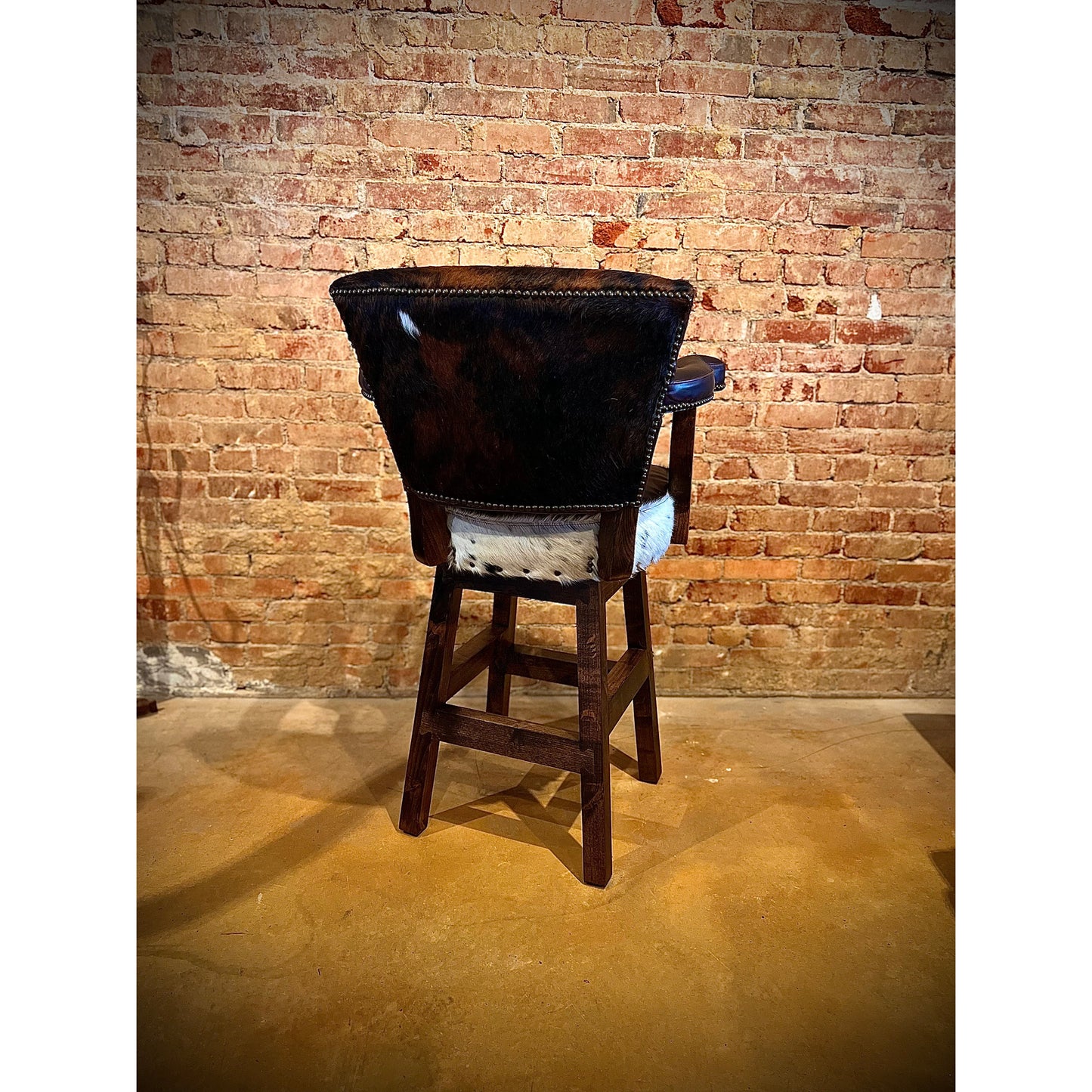 Experience ultimate comfort with our Cowhide Chisum Barstool. Crafted with genuine cowhide, these barstools bring a touch of western style to any room. Relax and enjoy a comfortable seat while adding a unique and stylish touch to your home decor.