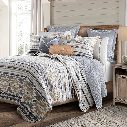 Bring a subtle Southwestern style to your bedroom with the Desert Sage Quilt Set. Its modern Aztec-style kilim pattern is complemented by a tan flange border and stipple quilting. The collection also features a coordinating canister set, and can be further enhanced by adding our linen cotton diamond quilt, velvet, woven leather, and washed linen pillows and shams.