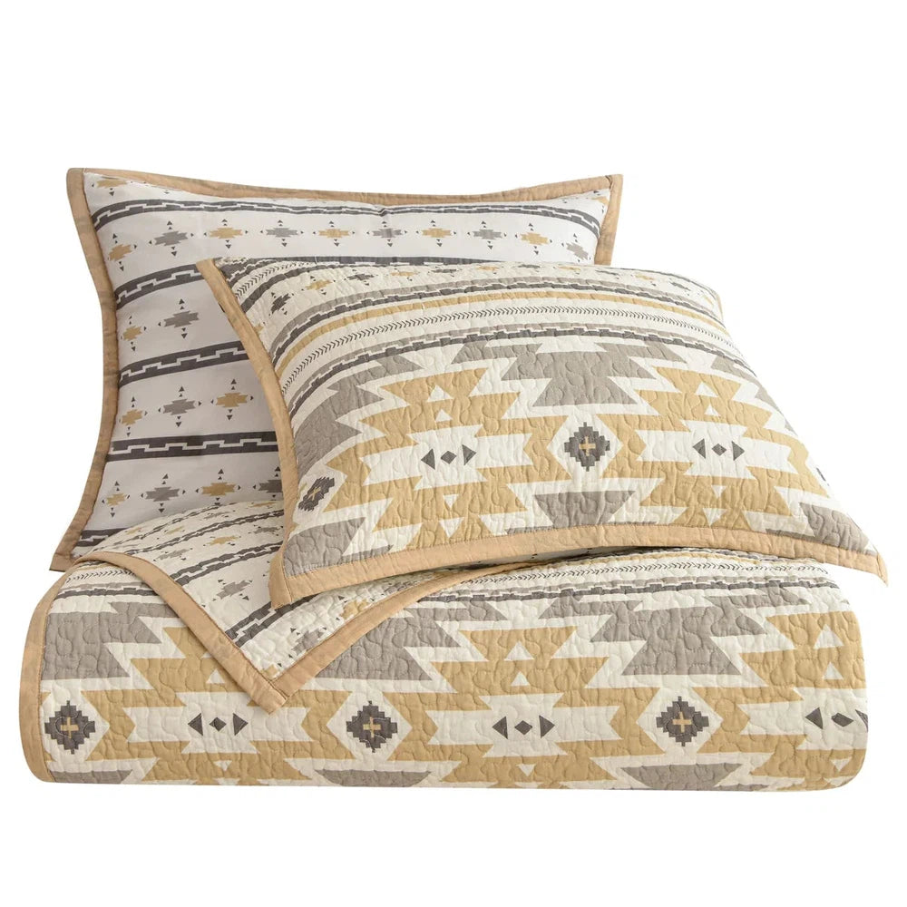 Bring a subtle Southwestern style to your bedroom with the Desert Sage Quilt Set. Its modern Aztec-style kilim pattern is complemented by a tan flange border and stipple quilting. The collection also features a coordinating canister set, and can be further enhanced by adding our linen cotton diamond quilt, velvet, woven leather, and washed linen pillows and shams.
