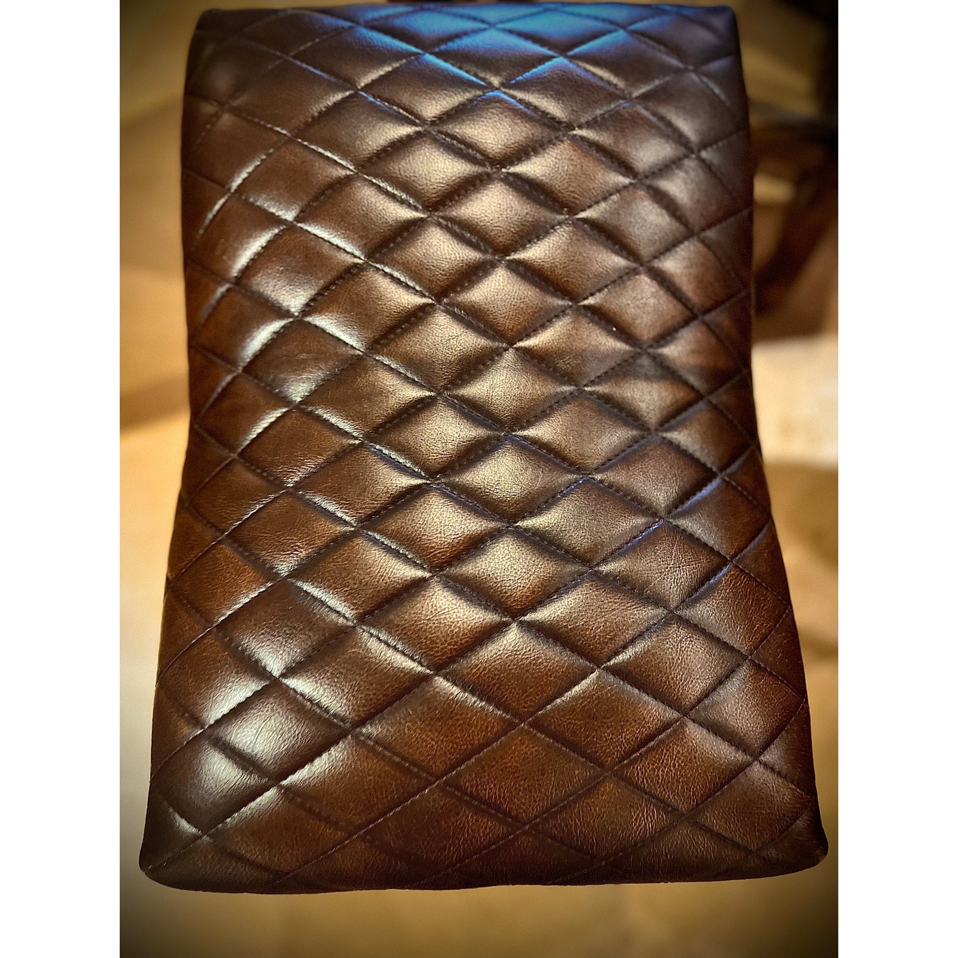 Introducing the Diamond Stitch Santana Saddle Stool. With its diamond stitch leather, this stool offers a touch of Western charm while providing exceptional comfort. A perfect addition to any home or office space.