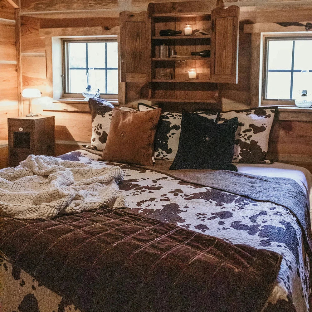Bring the Wild West to your bedroom with the Elsa Quilt Set. Reversible cotton quilts feature a charming ranch print to add a touch of rustic flair. The collection also includes cowhide-print sheets, Euro shams in luxe leather, and coordinating window treatments with fringe details. Create a warm and inviting atmosphere in your home with Elsa.