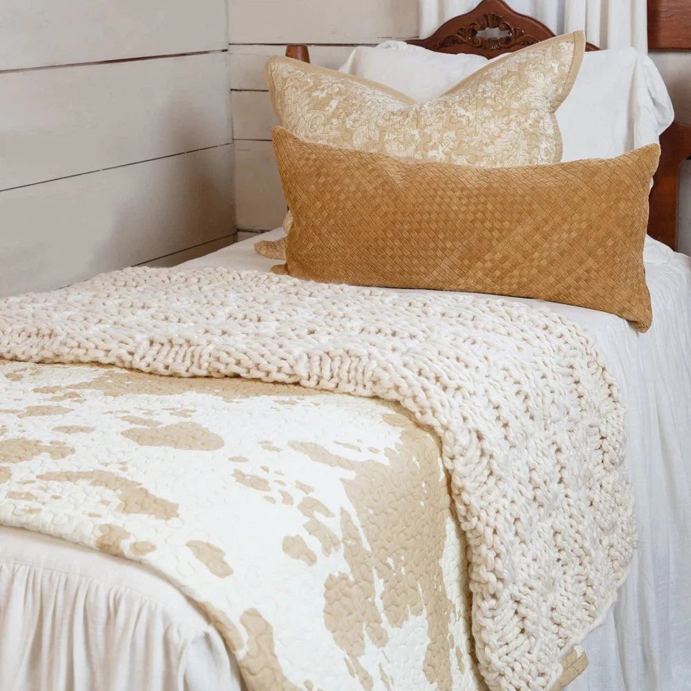 Bring the Wild West to your bedroom with the Elsa Quilt Set. Reversible cotton quilts feature a charming ranch print to add a touch of rustic flair. The collection also includes cowhide-print sheets, Euro shams in luxe leather, and coordinating window treatments with fringe details. Create a warm and inviting atmosphere in your home with Elsa.