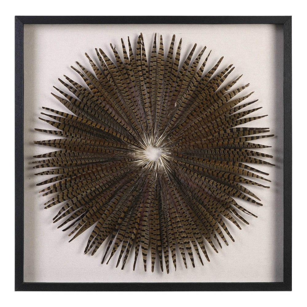 This Feather Burst Shadow Box is a unique work of art, crafted from natural materials to create a striking starburst design. Teeming with hints of blue and burgundy, each Pheasant feather is hand laid against a linen background, creating a luxurious display that will last for years. The shadow box frame is made of fir wood, with a sophisticated black finish, and the artwork is protected by a glass front.