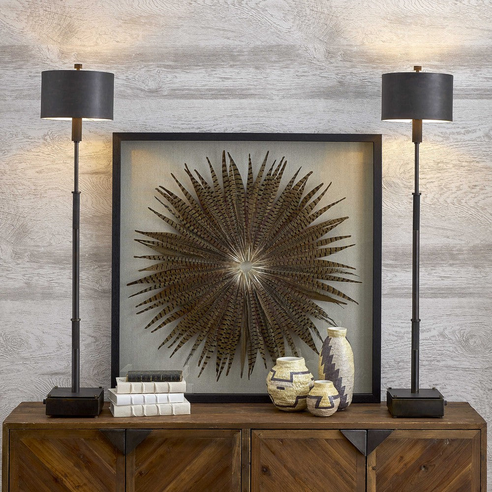 This Feather Burst Shadow Box is a unique work of art, crafted from natural materials to create a striking starburst design. Teeming with hints of blue and burgundy, each Pheasant feather is hand laid against a linen background, creating a luxurious display that will last for years. The shadow box frame is made of fir wood, with a sophisticated black finish, and the artwork is protected by a glass front.