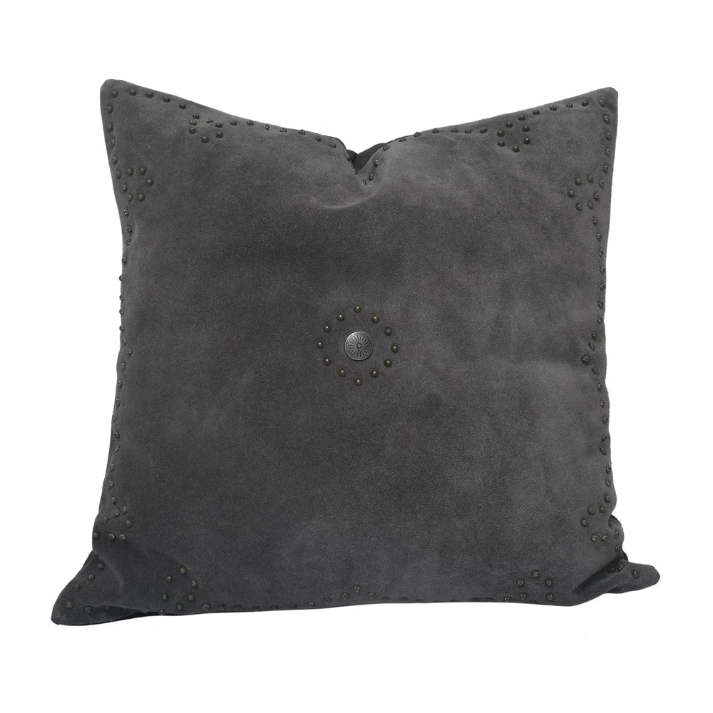 Classically crafted in suede, this Western Concho Pillow is perfect for any living space. Boasting a single silver concho center and a silver-studded border, its rustic elegance is available in four versatile shades: black, gray, navy, and tobacco. Add a luxurious touch to your the home with this timeless option.