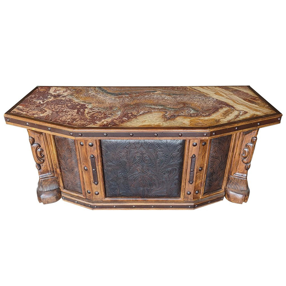 This stunning Hand Carved Tooled Leather Desk is sure to be the focal point of any room. Crafted with hand-carved tooled leather panels and a travertine top, this gorgeous piece provides a timeless look with its classic details and durable construction. Its unique character will make a lasting impression.
