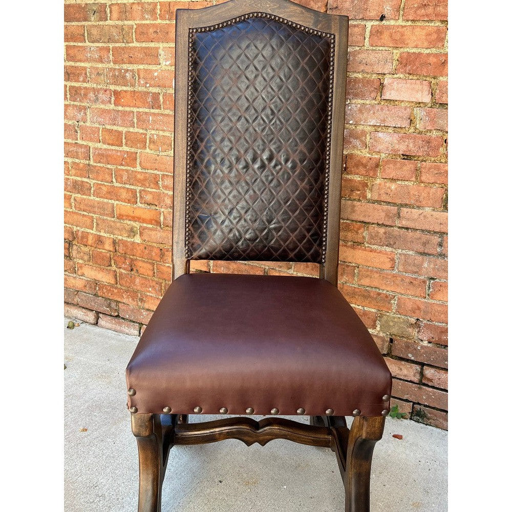 The Hobb Dining Chair has an eye-catching diamond stitch leather upholstery to bring an elegant touch to any space. Its top grain leather, wood frame, and rich brown finishes ensure that it is both durable and timeless. Perfect for a sophisticated yet cozy home.