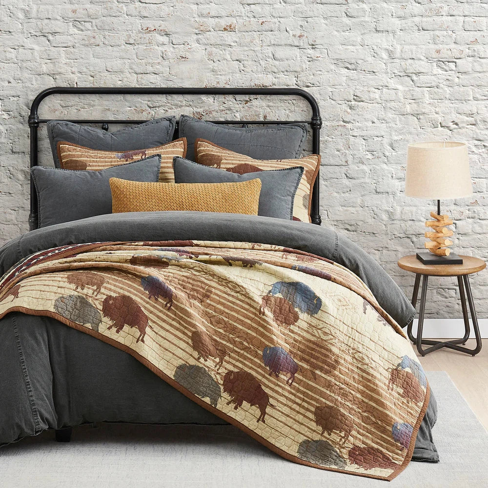 Featuring bold colors that capture the wild spirit of the American West, our Home On The Range Quilt Set is a striking homage to the iconic buffalo. Crafted with Aztec patterned fabric and a geometric ombre reverse, this quilt boasts alternating stripes and tribal motifs for an eye-catching look.