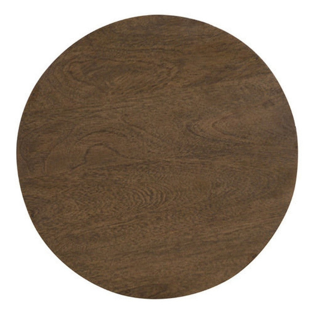 The Lewiston Drum End Table is an attractive accent piece crafted with Mango wood and designed with a simple, yet eye-catching asthetic. Its unique shape and contrasting wood grains make it a timeless addition to your home.