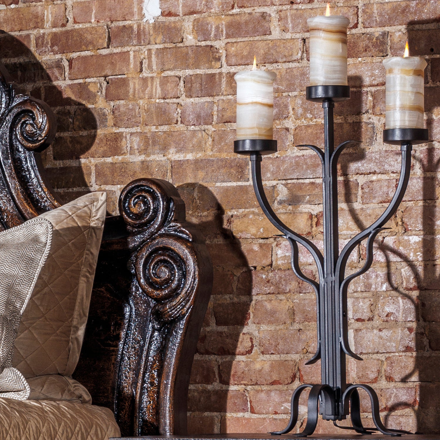 Romantic western bed with curved carved headboard and antiqued wood finish in an intimate bedroom