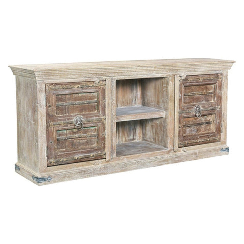 Be captivated by the rustic elegance of our Rainforest TV Stand. Crafted from solid mango wood and old doors, this unique piece is sure to make a statement in any living area. Enjoy the beauty of nature for years to come.