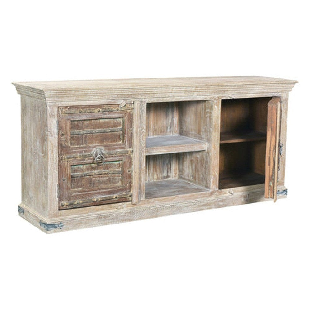 Be captivated by the rustic elegance of our Rainforest TV Stand. Crafted from solid mango wood and old doors, this unique piece is sure to make a statement in any living area. Enjoy the beauty of nature for years to come.