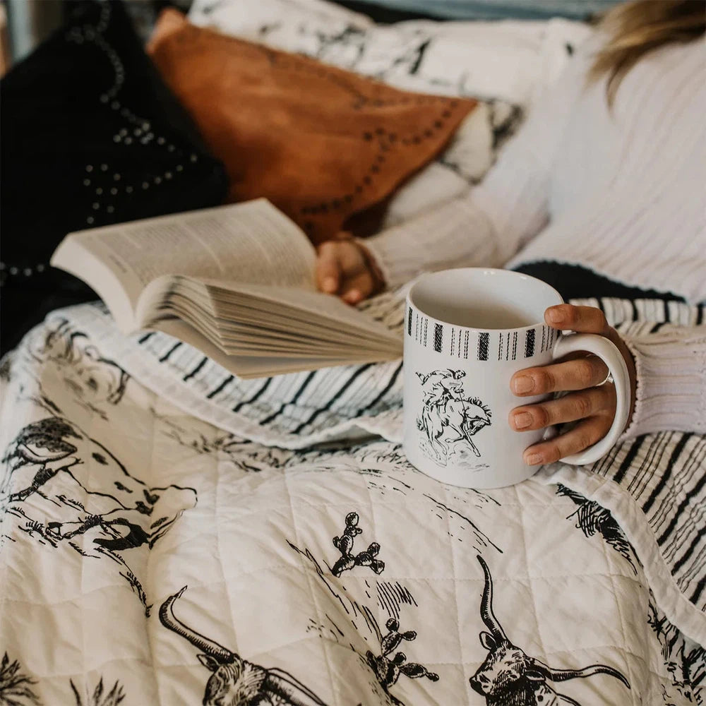 Explore the wild West with our Ranch Life Western Toile Quilt Set. Reversible and perfect for modern and traditional Western interiors, the quilt features a classic black-and-white toile design with ticking stripes for a timeless look.