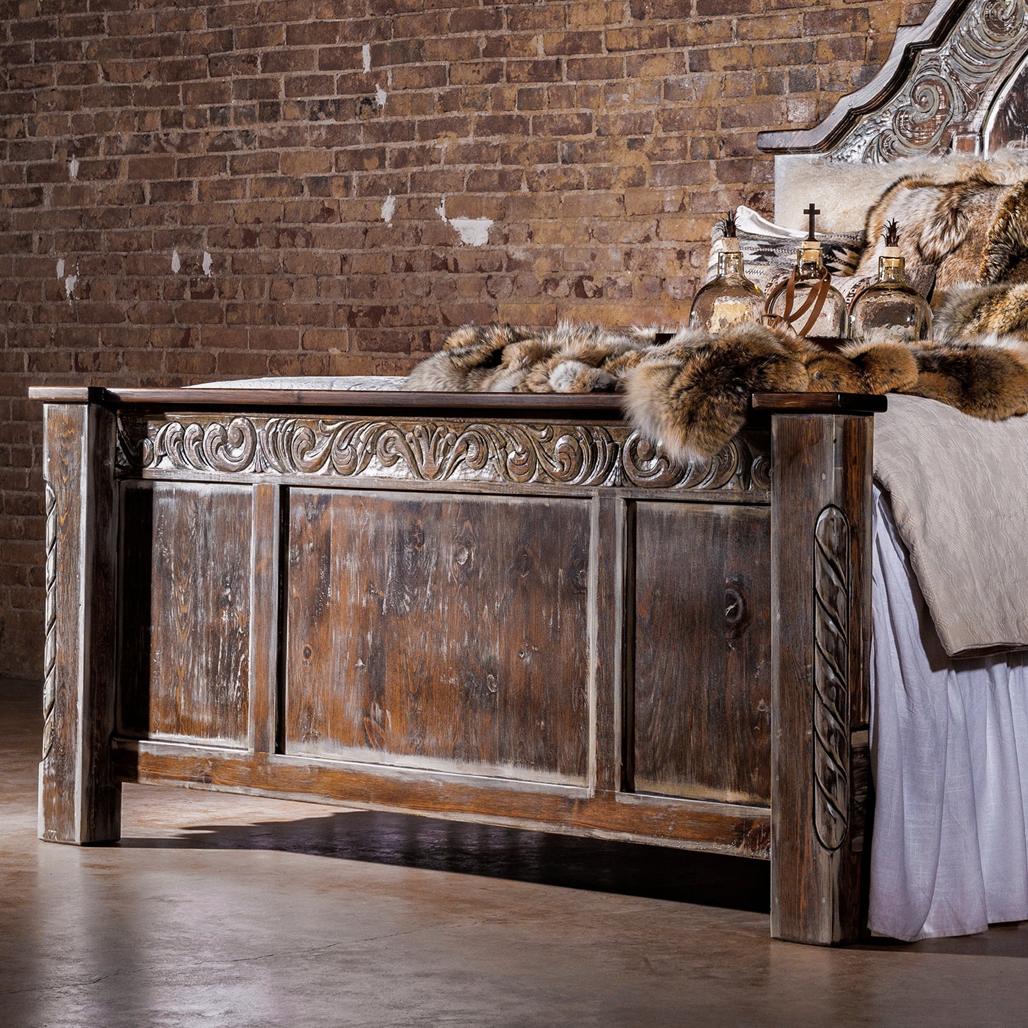 Refined western wood bed frame with paneled headboard in a softly lit bedroom