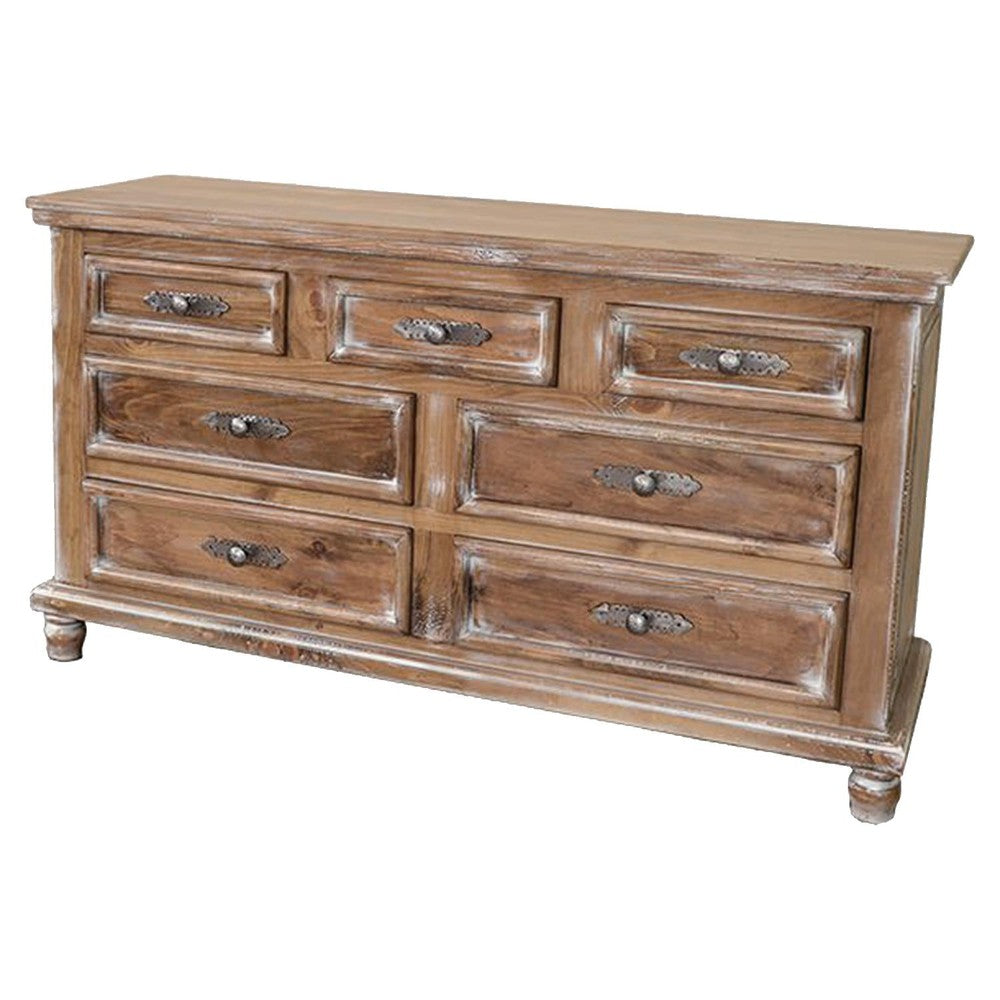 Distressed wooden dresser with seven drawers and decorative metal handles