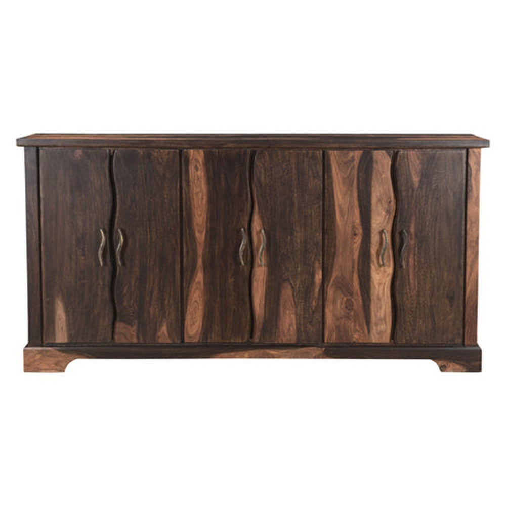 The Riviera Sideboard is an elegant piece of furniture with a refined dark finish. It features a live edge wood design and curved metal accents that add a modern touch. Perfect for stylishly stowing away your belongings, this sideboard is sure to elevate any living space.