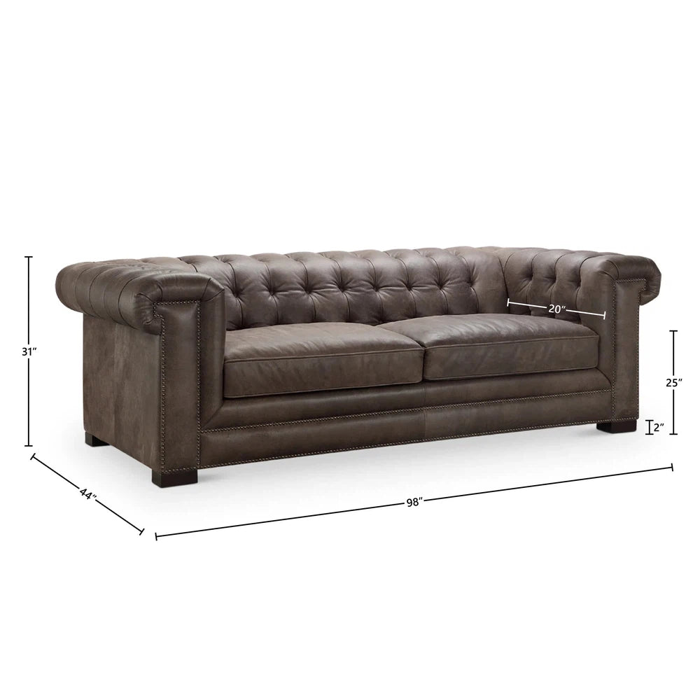 This luxurious Selleck Sofa features a sturdy hardwood frame, pocketed coil seating for comfort, panel key arm and button tufted design. Upholstered in supple top grain leather all over, its design is suitable for both western and contemporary decor. Experience sumptuous comfort with the Selleck Sofa.