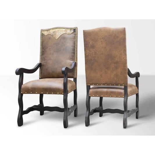 The Sonora Dining Chair is the perfect combination of comfort and style. Crafted with a solid wood frame and microfiber upholstery that looks like leather, it's easy to clean and maintain. Plus, it features a western-inspired design with a hair on cowhide yoke, nailhead accents and a distressed finish.