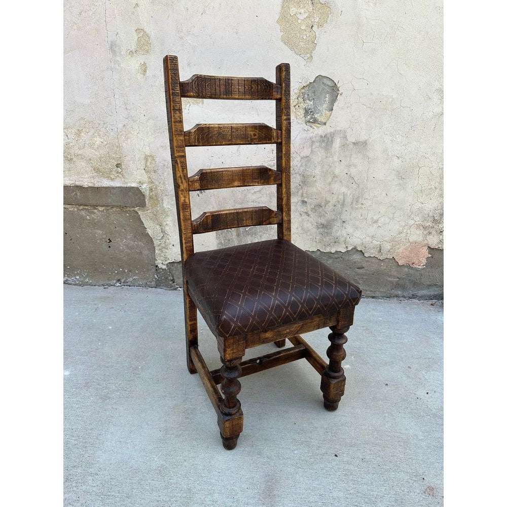 Elevate your dining room with the Sonora Dining Chair. This stylish chair is crafted of reclaimed wood, with a ladder back style for comfort and elegance, and a top grain diamond stamp leather seat for maximum comfort. Perfect for any dining room.