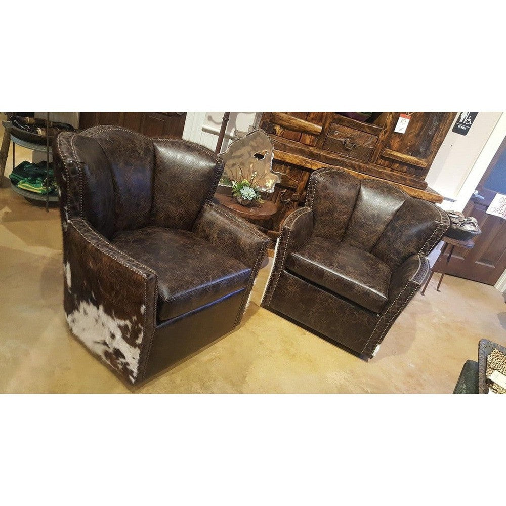 This Standard Cowboy Conch Chair is designed for maximum comfort and luxury. It features a large swiveling seat upholstered in top grain leather with a luxurious diamond stitch leather trim and tri colored cowhide. Exquisite craftsmanship and superior materials make this chair an ideal choice for any room.