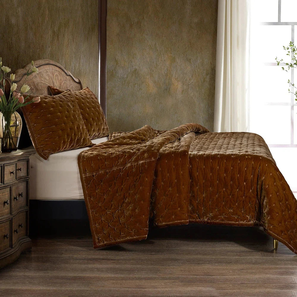 Our Stella Velvet Quilt brings a luxurious sheen to your bedding with its rich faux silk velvet fabric. The quilted design provides subtle texture, while its selection of neutral and vibrant jewel tone colors will fit seamlessly into your home's traditional, Western, or rustic décor. Enjoy its soft, sumptuous feel and complete the look by pairing it with other pieces from the Stella Collection.