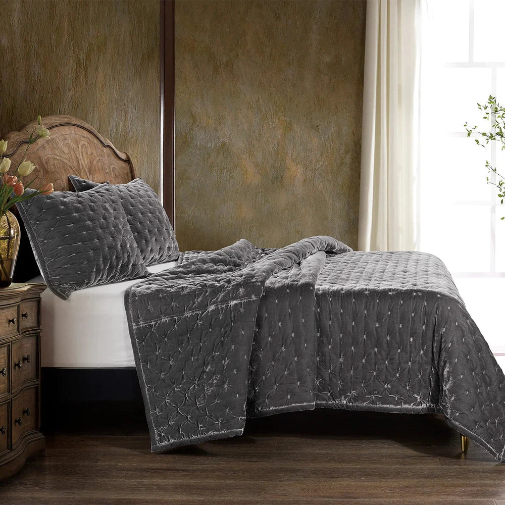 Our Stella Velvet Quilt brings a luxurious sheen to your bedding with its rich faux silk velvet fabric. The quilted design provides subtle texture, while its selection of neutral and vibrant jewel tone colors will fit seamlessly into your home's traditional, Western, or rustic décor. Enjoy its soft, sumptuous feel and complete the look by pairing it with other pieces from the Stella Collection.