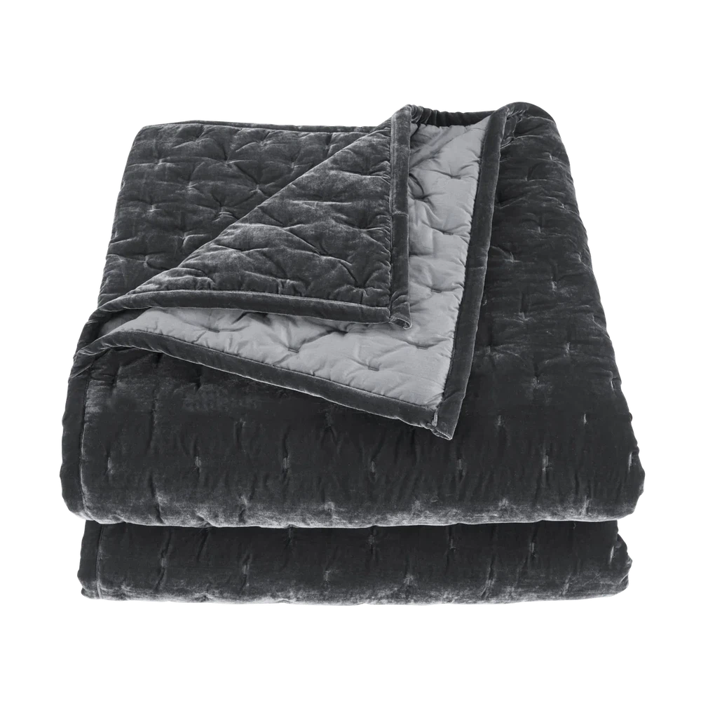 Our Stella Velvet Quilt brings a luxurious sheen to your bedding with its rich faux silk velvet fabric. The quilted design provides subtle texture, while its selection of neutral and vibrant jewel tone colors will fit seamlessly into your home's traditional, Western, or rustic décor. Enjoy its soft, sumptuous feel and complete the look by pairing it with other pieces from the Stella Collection.