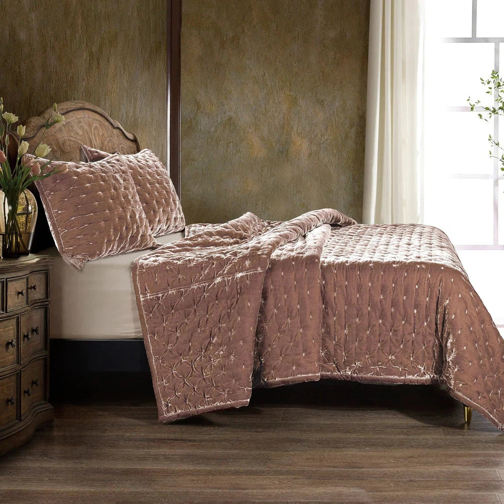 Our Stella Velvet Quilt brings a luxurious sheen to your bedding with its rich faux silk velvet fabric. The quilted design provides subtle texture, while its selection of neutral and vibrant jewel tone colors will fit seamlessly into your home's traditional, Western, or rustic décor. Enjoy its soft, sumptuous feel and complete the look by pairing it with other pieces from the Stella Collection.