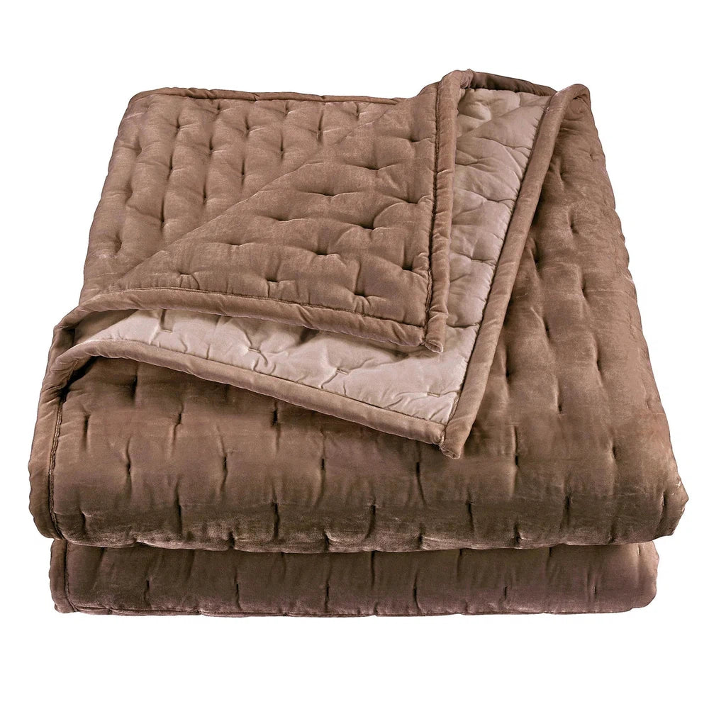 Our Stella Velvet Quilt brings a luxurious sheen to your bedding with its rich faux silk velvet fabric. The quilted design provides subtle texture, while its selection of neutral and vibrant jewel tone colors will fit seamlessly into your home's traditional, Western, or rustic décor. Enjoy its soft, sumptuous feel and complete the look by pairing it with other pieces from the Stella Collection.
