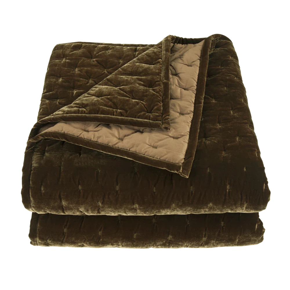 Our Stella Velvet Quilt brings a luxurious sheen to your bedding with its rich faux silk velvet fabric. The quilted design provides subtle texture, while its selection of neutral and vibrant jewel tone colors will fit seamlessly into your home's traditional, Western, or rustic décor. Enjoy its soft, sumptuous feel and complete the look by pairing it with other pieces from the Stella Collection.