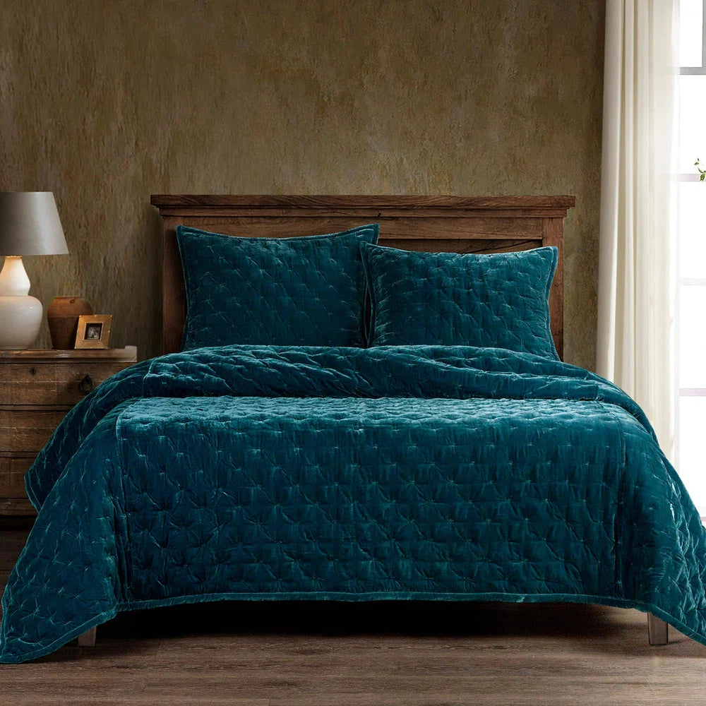 Our Stella Velvet Quilt brings a luxurious sheen to your bedding with its rich faux silk velvet fabric. The quilted design provides subtle texture, while its selection of neutral and vibrant jewel tone colors will fit seamlessly into your home's traditional, Western, or rustic décor. Enjoy its soft, sumptuous feel and complete the look by pairing it with other pieces from the Stella Collection.