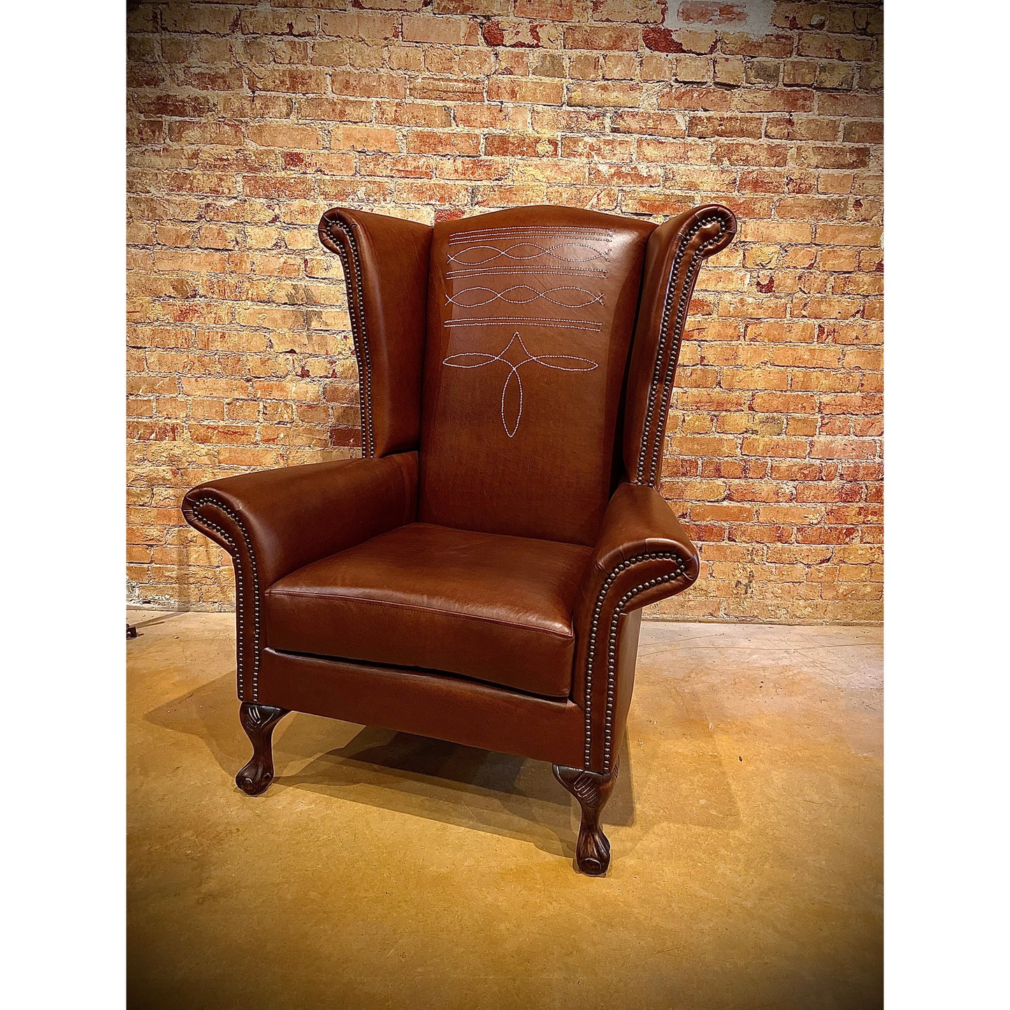 Step up your interior design game with the Stetson Wingback Chair. Crafted with a distinctive boot stitch and elegant wingback design, this chair exudes rustic charm. Elevate your space with a touch of sophistication and comfort.