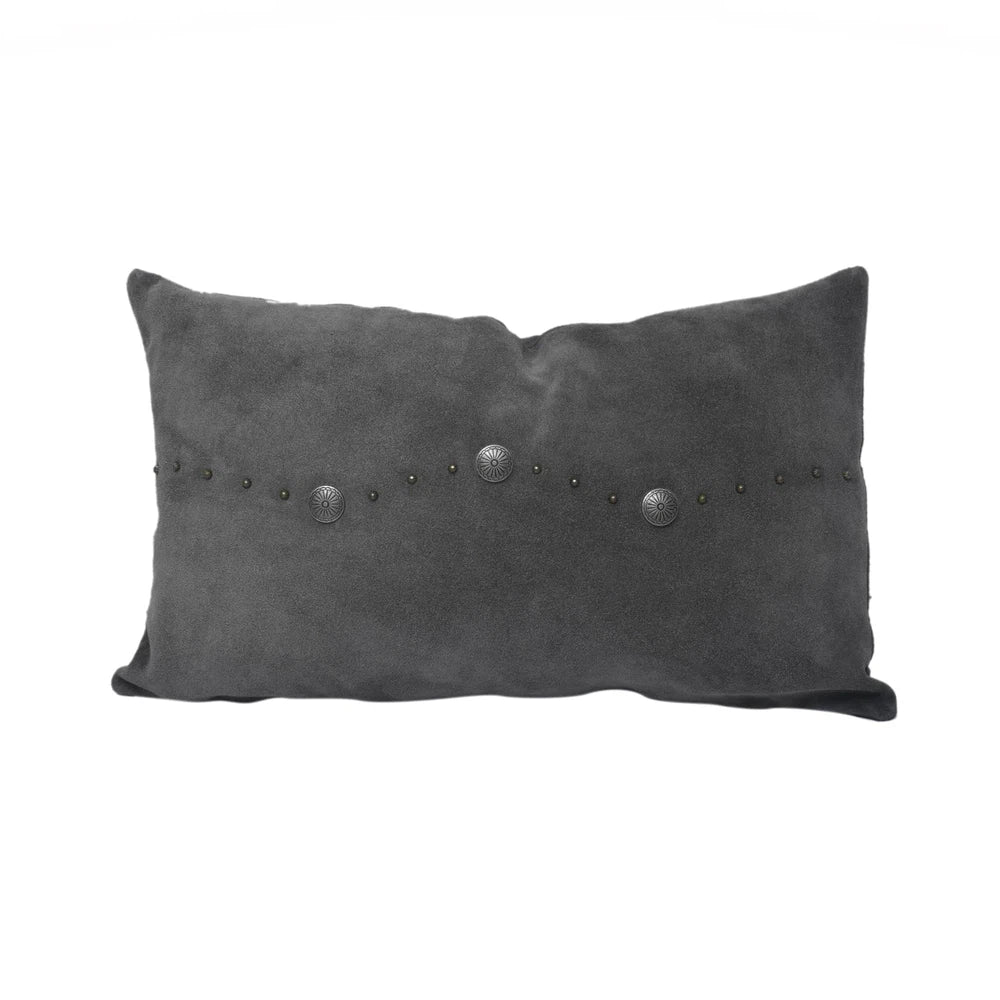 Classically crafted in suede, this Western Concho Pillow is perfect for any living space. Boasting a single silver concho center and a silver-studded border, its rustic elegance is available in four versatile shades: black, gray, navy, and tobacco. Add a luxurious touch to your the home with this timeless option.