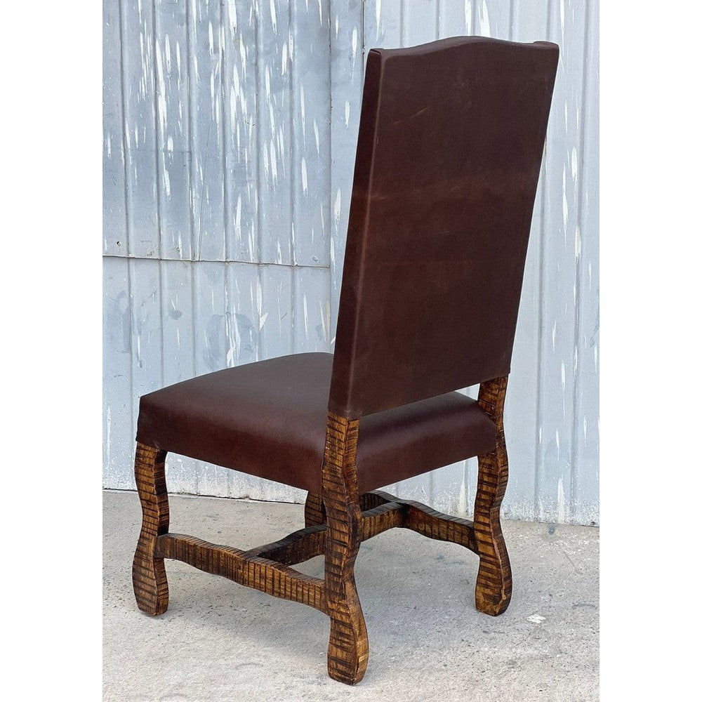 Experience luxury and elegance with the Tejas Dining Chair. This chair features a solid wood frame, top grain leather seat, and axis hide for a sophisticated look. From its high-end materials to its stunning Western-inspired design, this chair makes a stylish statement in any dining room.