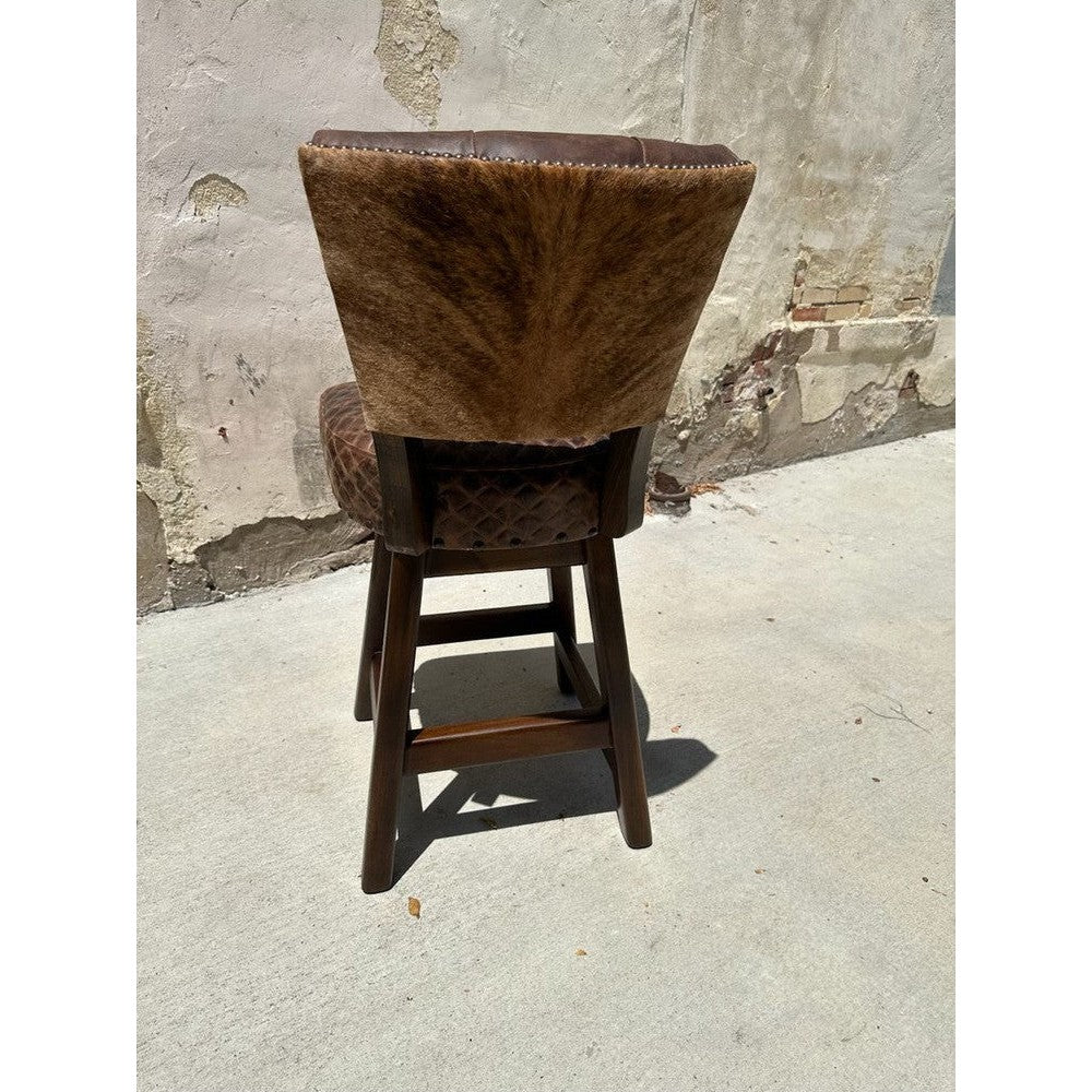 This swivel stool is designed for comfort and luxury, with a top-grain leather cushion and tufted back, perfect for your counter or bar. It comes with a cowhide back, and can be with arms or armless. Enjoy maximum comfort with this stylish, high-quality stool.