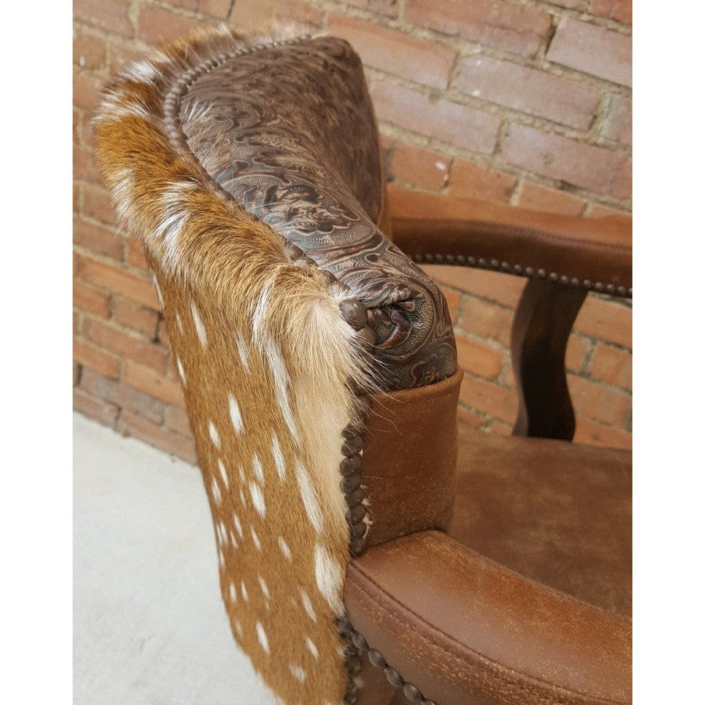 Bring the rustic appeal of the Wild West to your home with the Uptown Cowboy Swivel Stool. Crafted with top grain leather and axis hair on hide, this swivel bar or counter stool also features a stamped leather yoke, and comes in arm or armless options so you can customize it for your space.