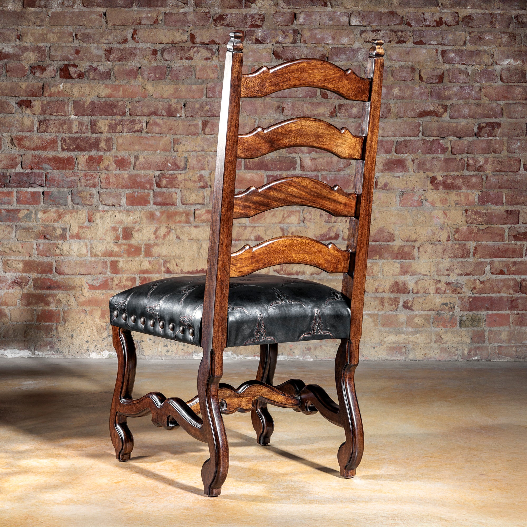 Back view of hand-embossed black leather longhorn dining chair