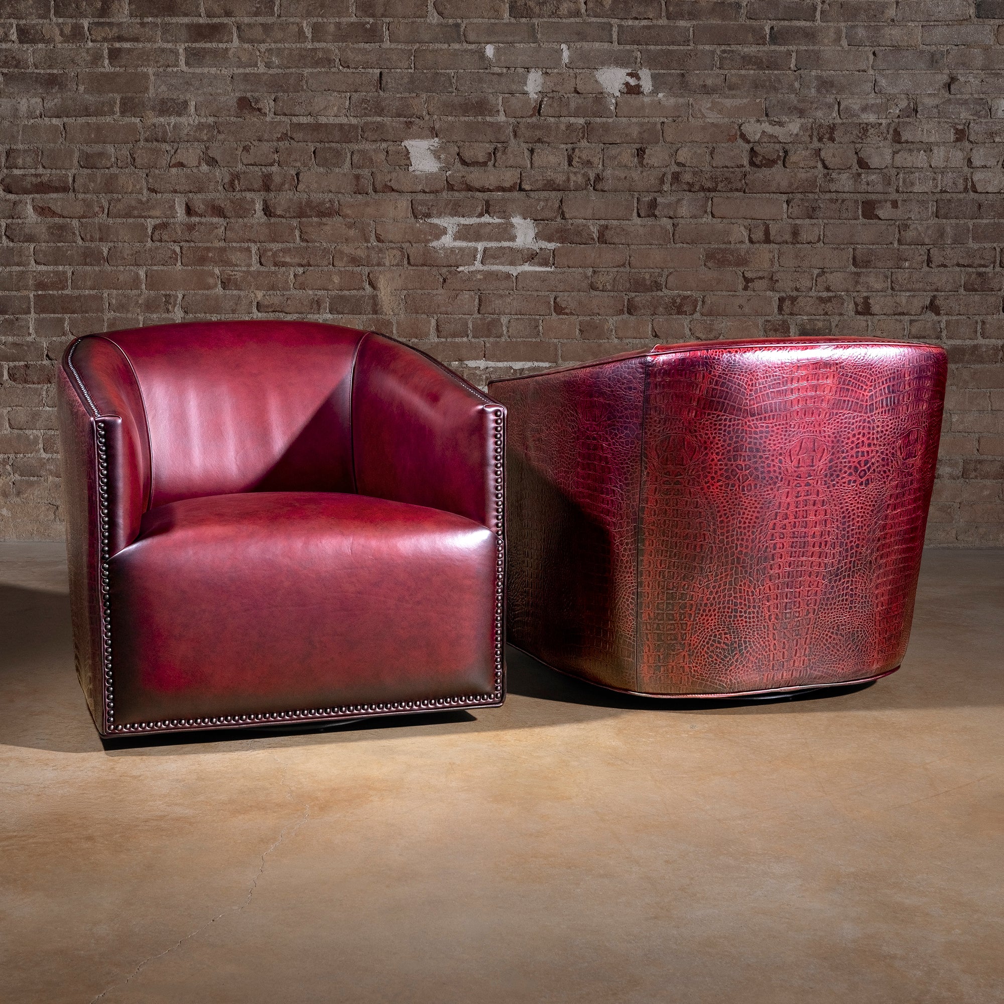 Bordeaux Croc Chair western swivel chair duo showing red leather interior and croc-embossed outer back with nailheads