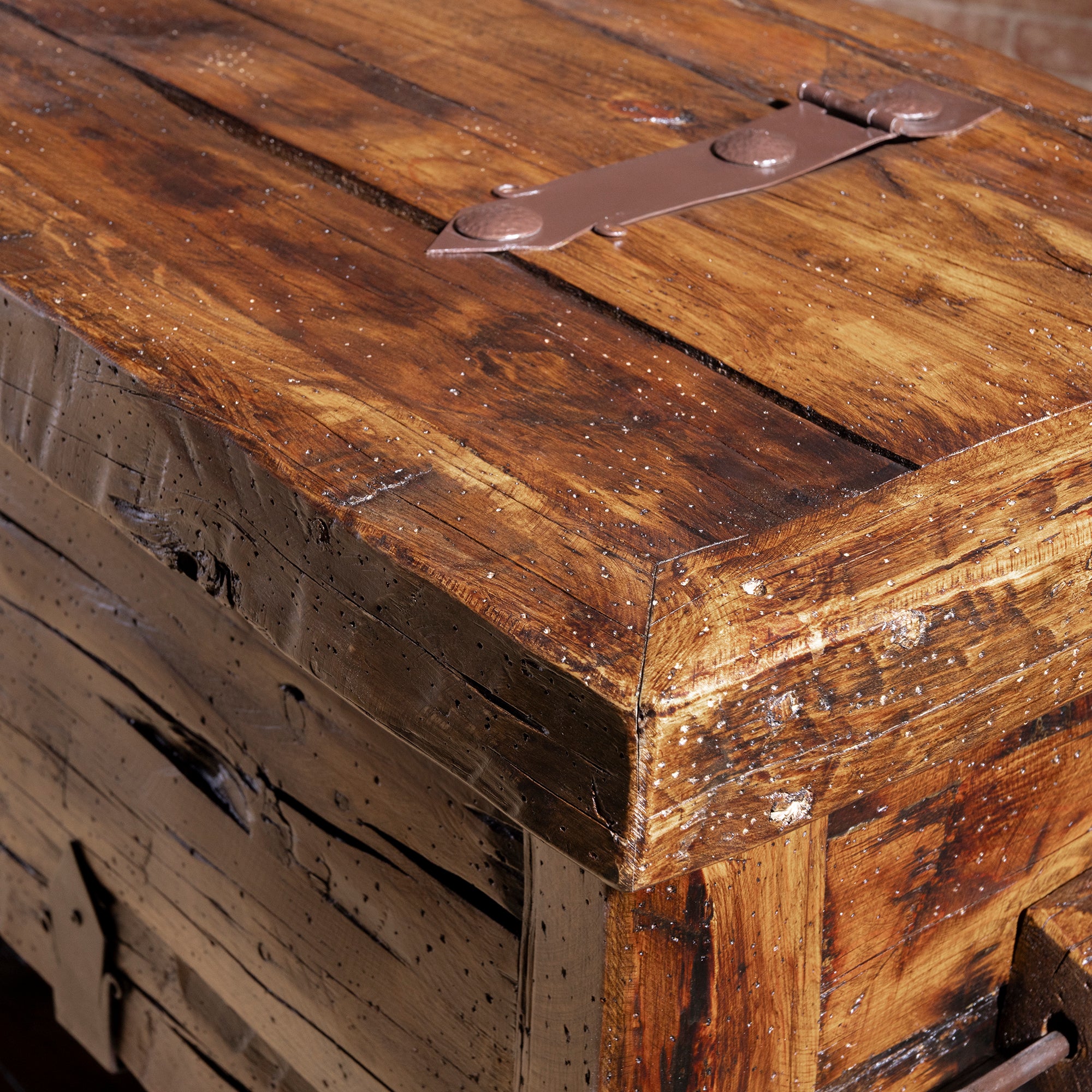 Bosque Timber Vault top corner detail with aged reclaimed planks and dark iron strap hardware