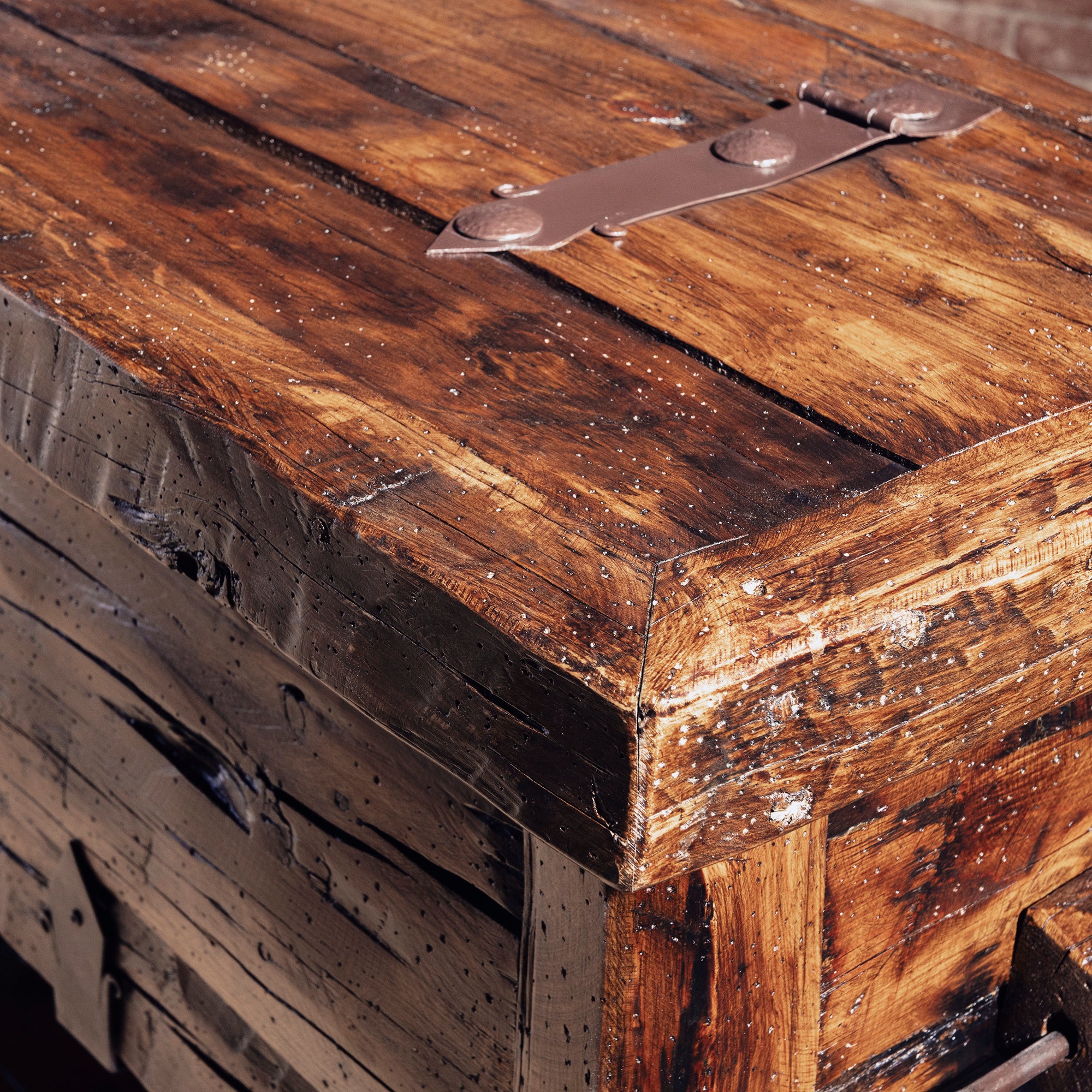 Bosque Timber Vault top corner detail with aged reclaimed planks and dark iron strap hardware