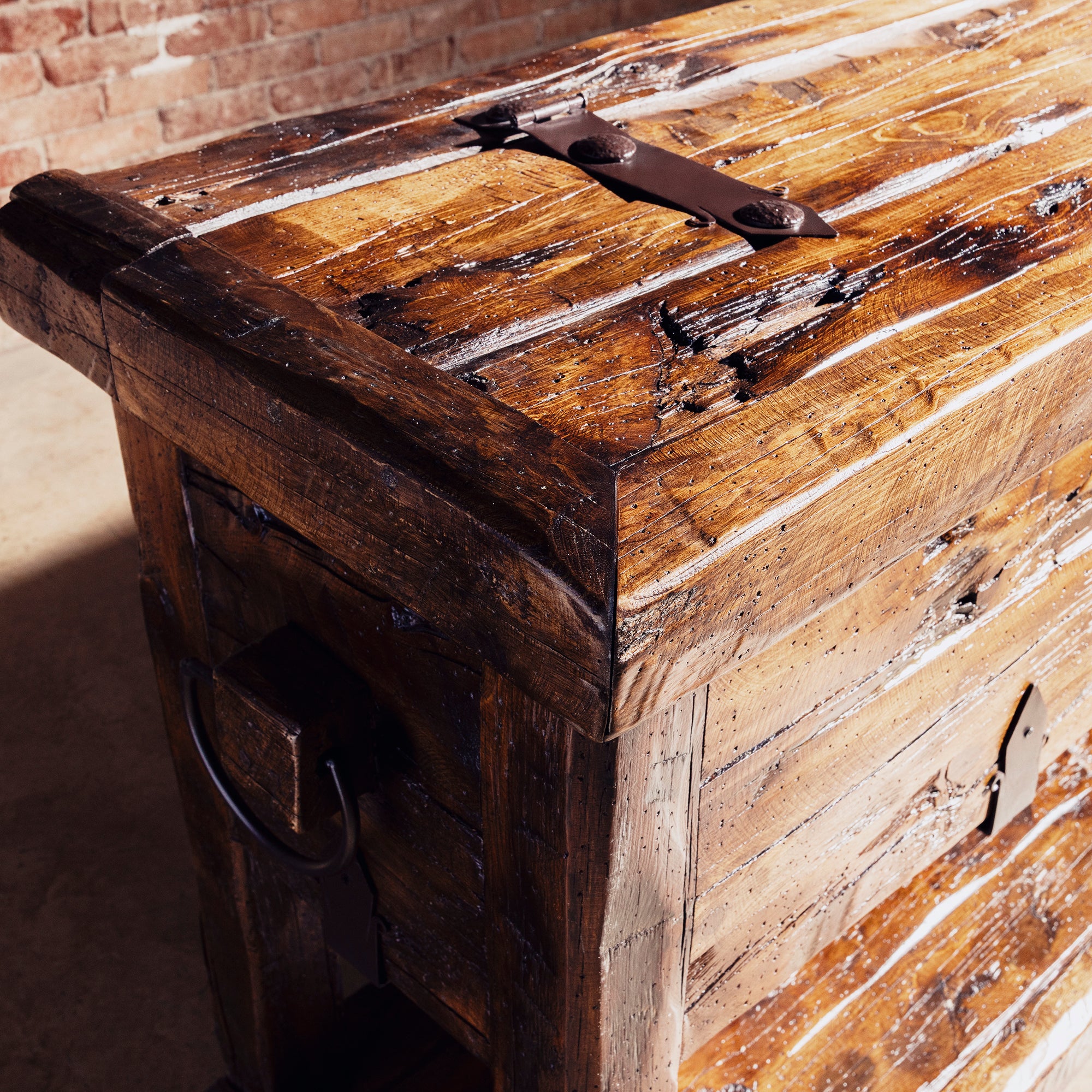 Bosque Timber Vault top corner detail with aged reclaimed planks and dark iron strap hardware
