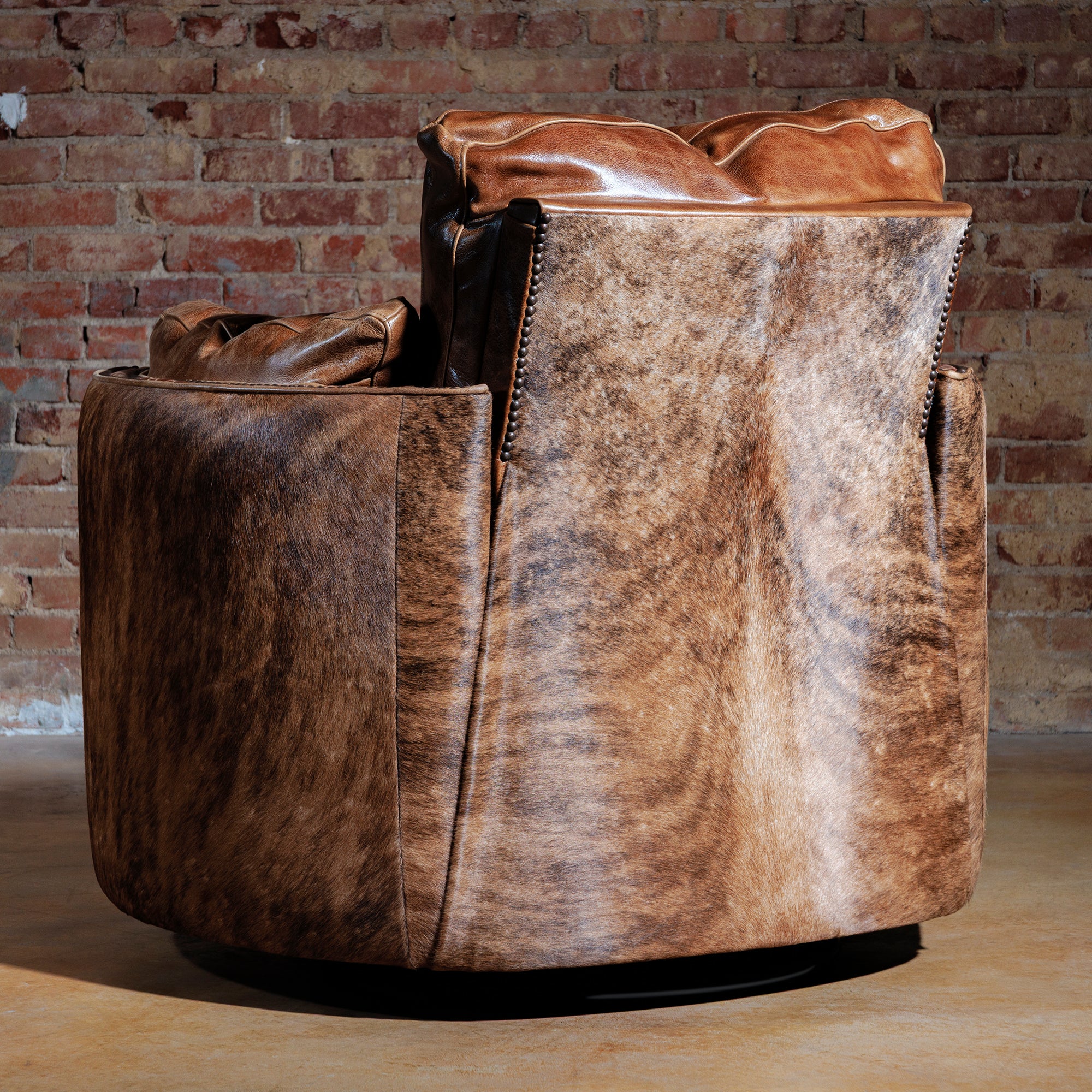 Back view of handcrafted Western recliner with cowhide panel and wood frame