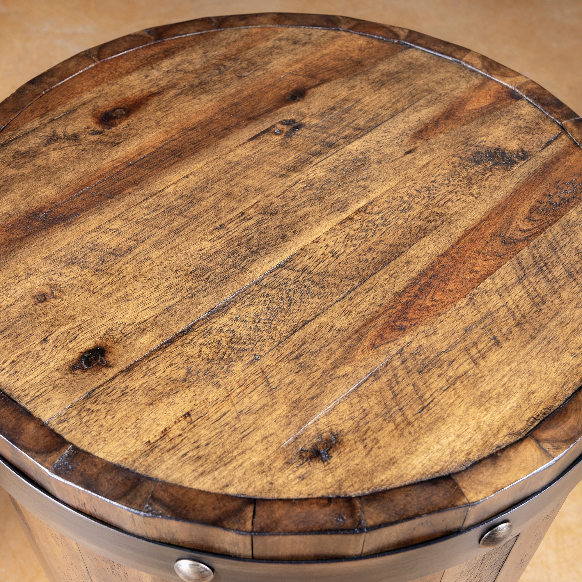 Round reclaimed wood top detail on rustic Western barrel accent table