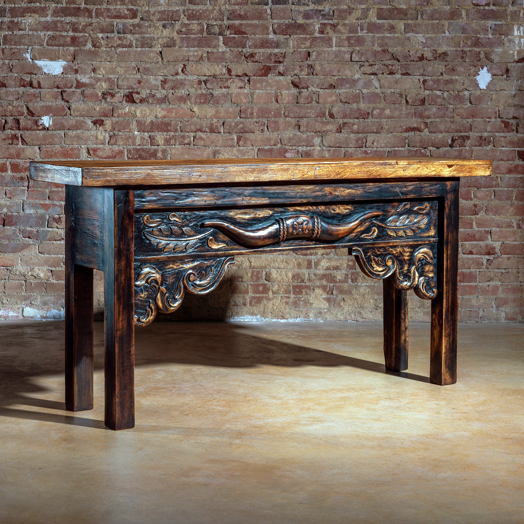 Hand-carved rustic Western console table with longhorn detail and artisan wood finish – angled view.