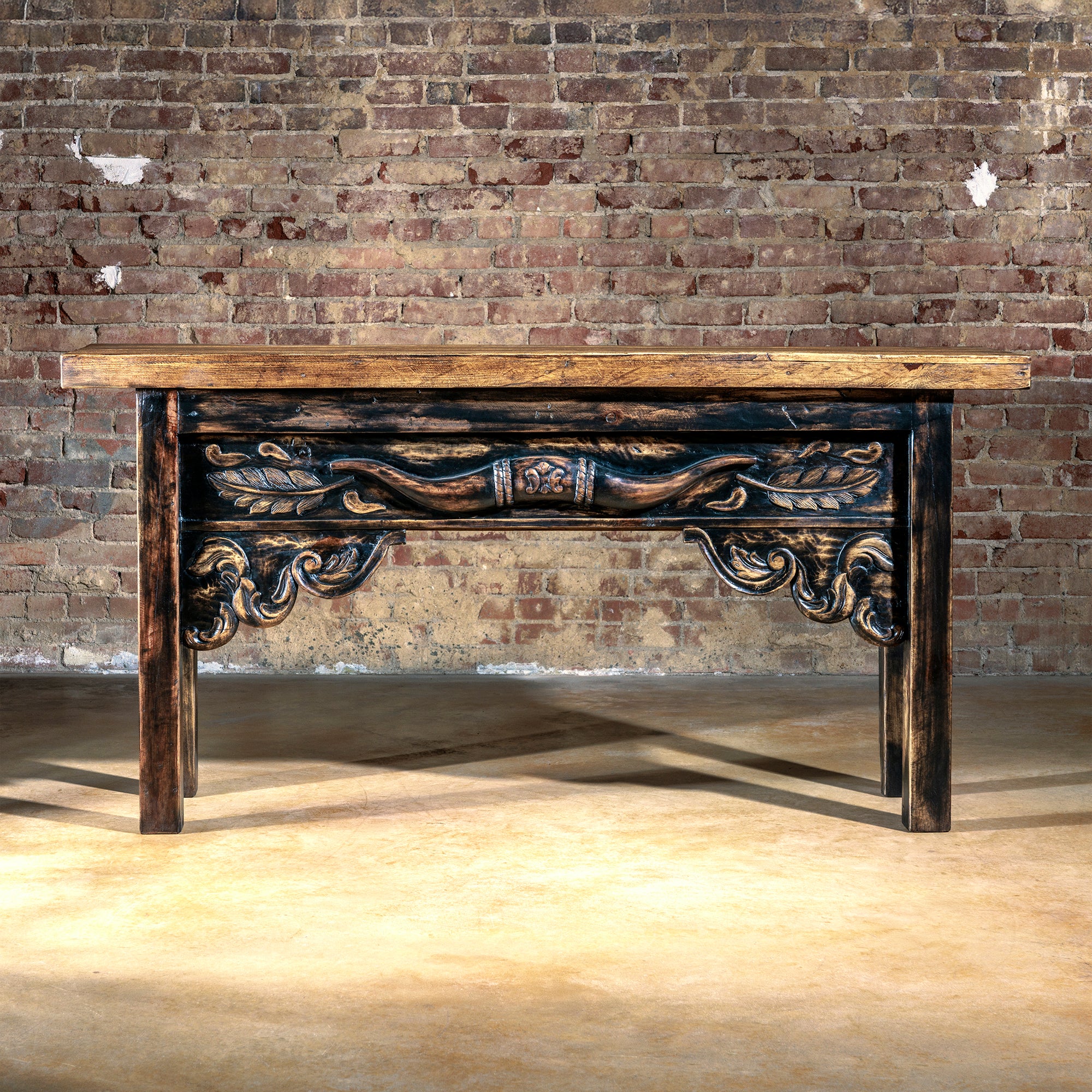 Front view of the Cattleman’s Crest Console showcasing ornate longhorn carving and heirloom-quality craftsmanship.
